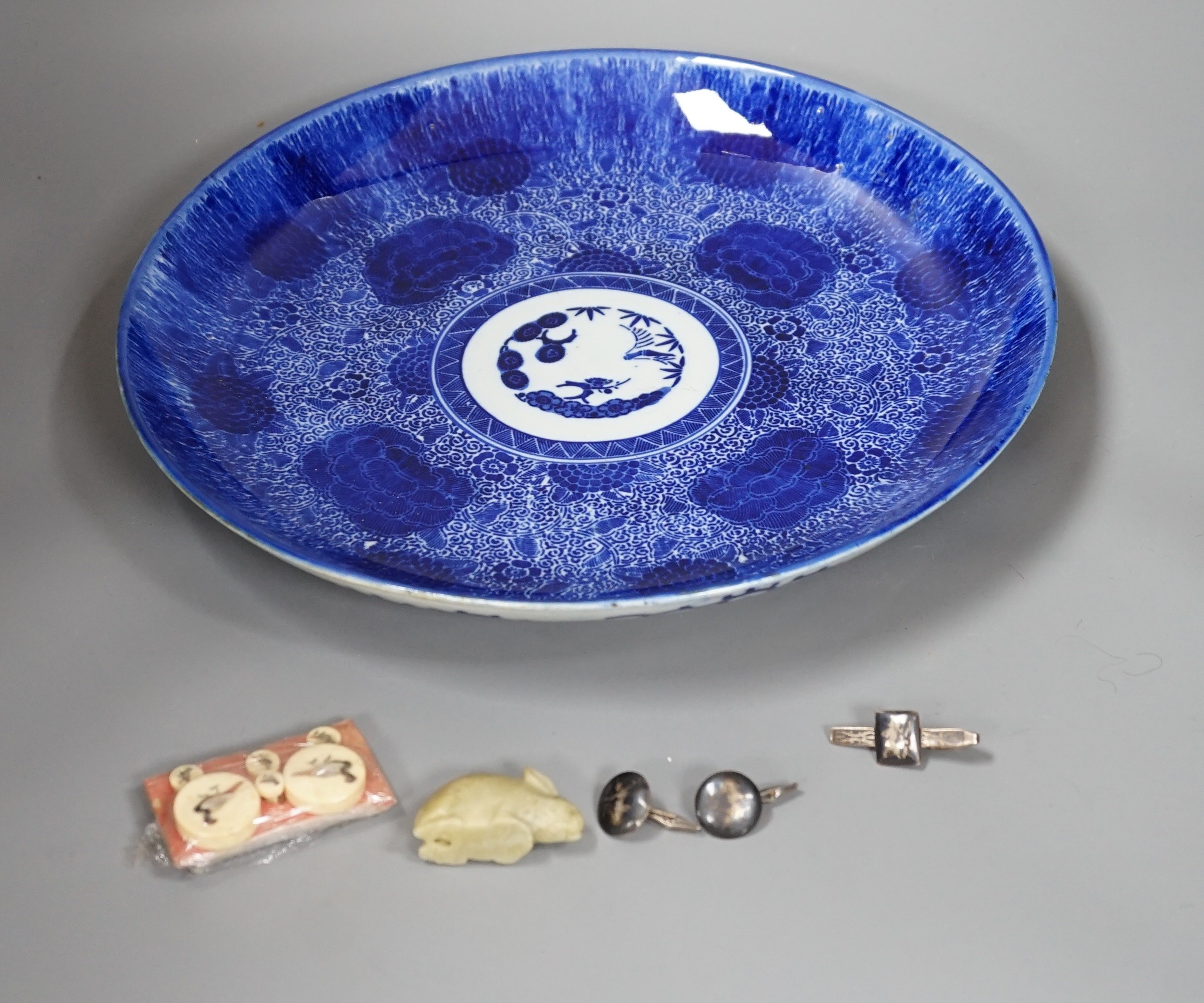 A Japanese Blue and White dish, a Set of Shibayama buttons, a soapstone rabbit, a Siamese cuff links and tie clip. Dish diameter 35cm